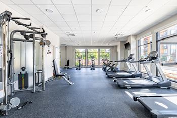 A spacious gym with treadmills, weights, and exercise equipment.at Traditions at Hazelwood, Portland, OR 97216